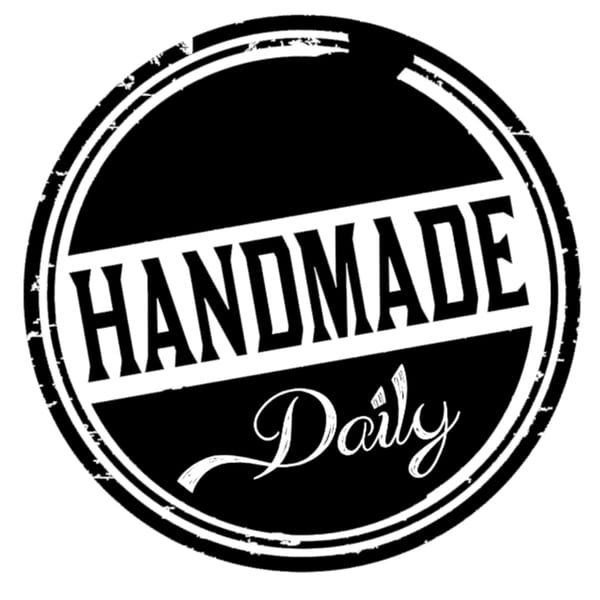 Black and white circular stamp with "HANDMADE Daily" in distressed text.